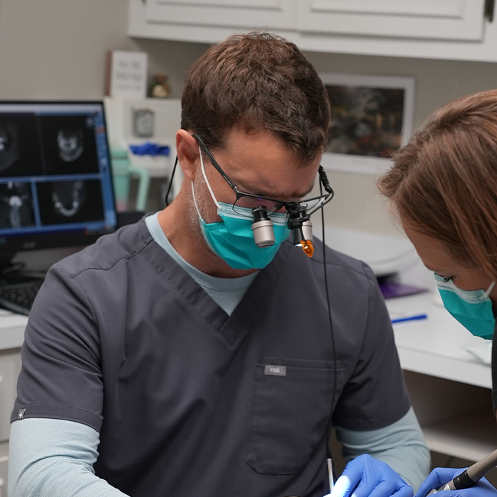 Dentist giving a patient a dental exam