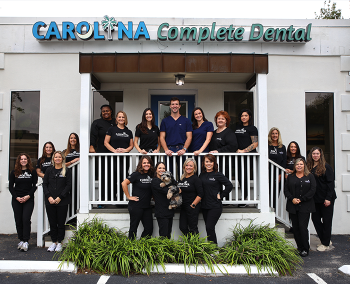 Goose Creek dental team members standing in front of Carolina Complete Dental office building